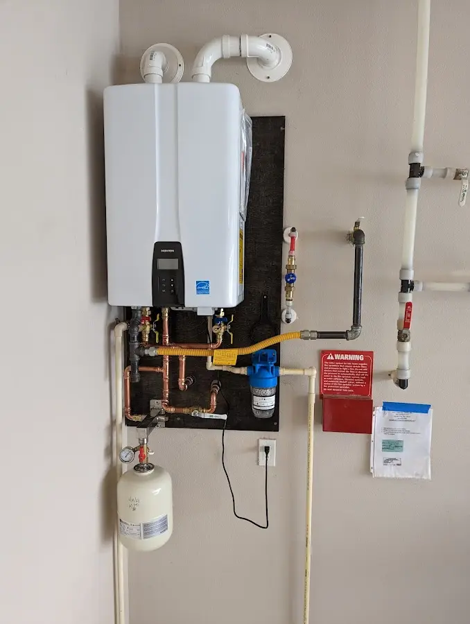 Professional plumber installing copper piping in a Largo home